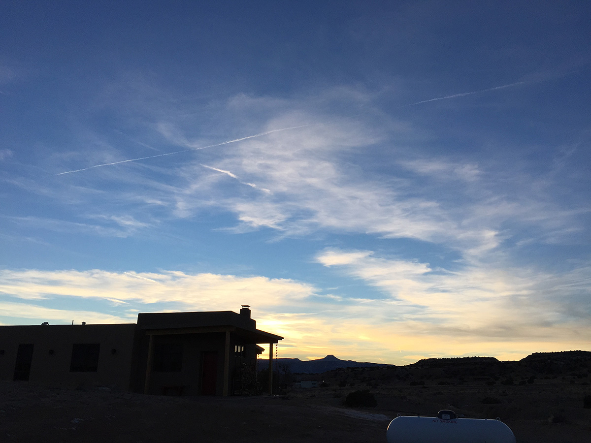 Sunset over a Santa Fe house in the desert.