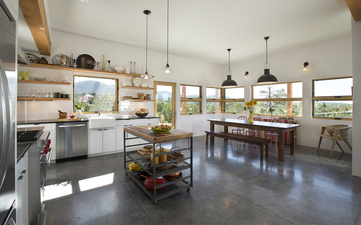 A kitchen designed by an architect, featuring a table and chairs.