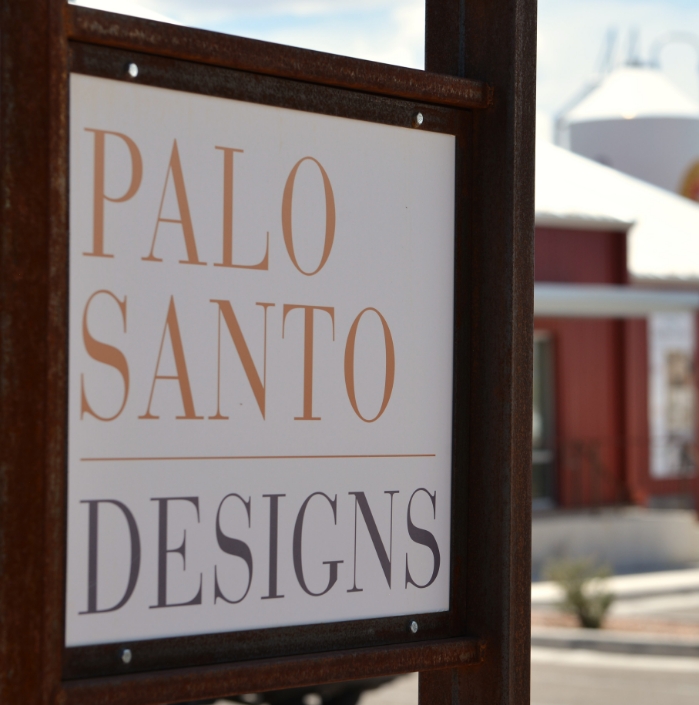 A palo santo designs sign for a home builder in Santa Fe.