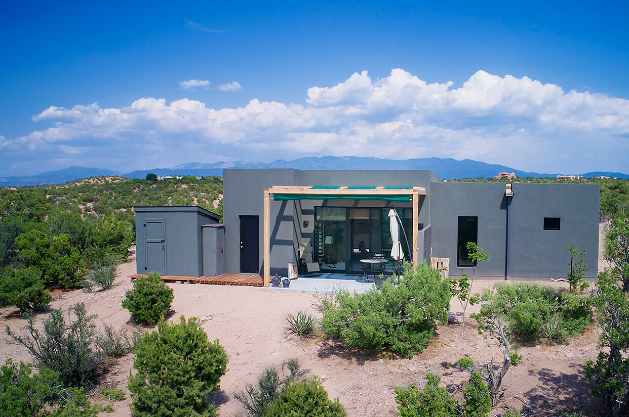 A modern architect's masterpiece, this stunning desert home showcases a unique touch with its striking green roof.