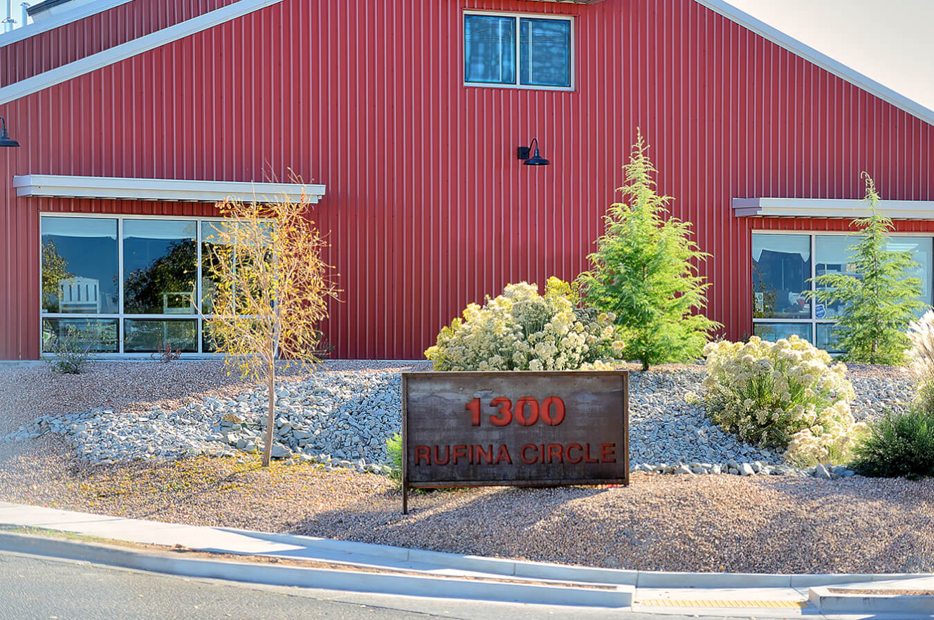          Description: A red building in Santa Fe with a sign on it.