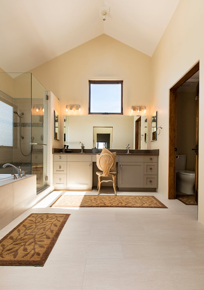 A large bathroom with a tub and shower, designed by an architect in Santa Fe.