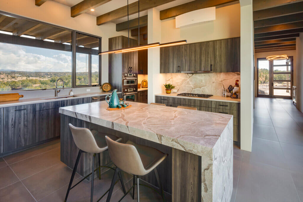 A modern kitchen designed by an architect, with a view of the mountains.