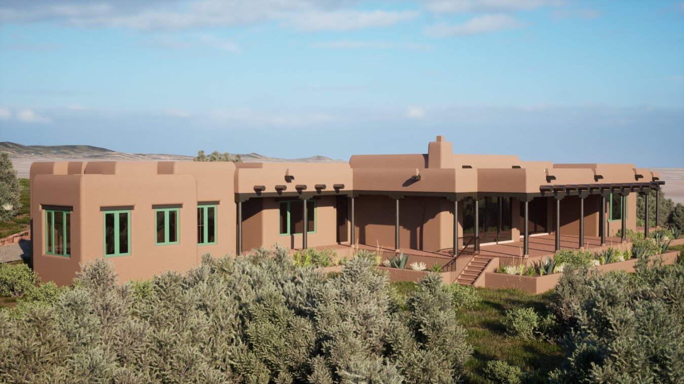 Single-story adobe-style house with green-trimmed windows and covered porch surrounded by desert vegetation under a blue sky.