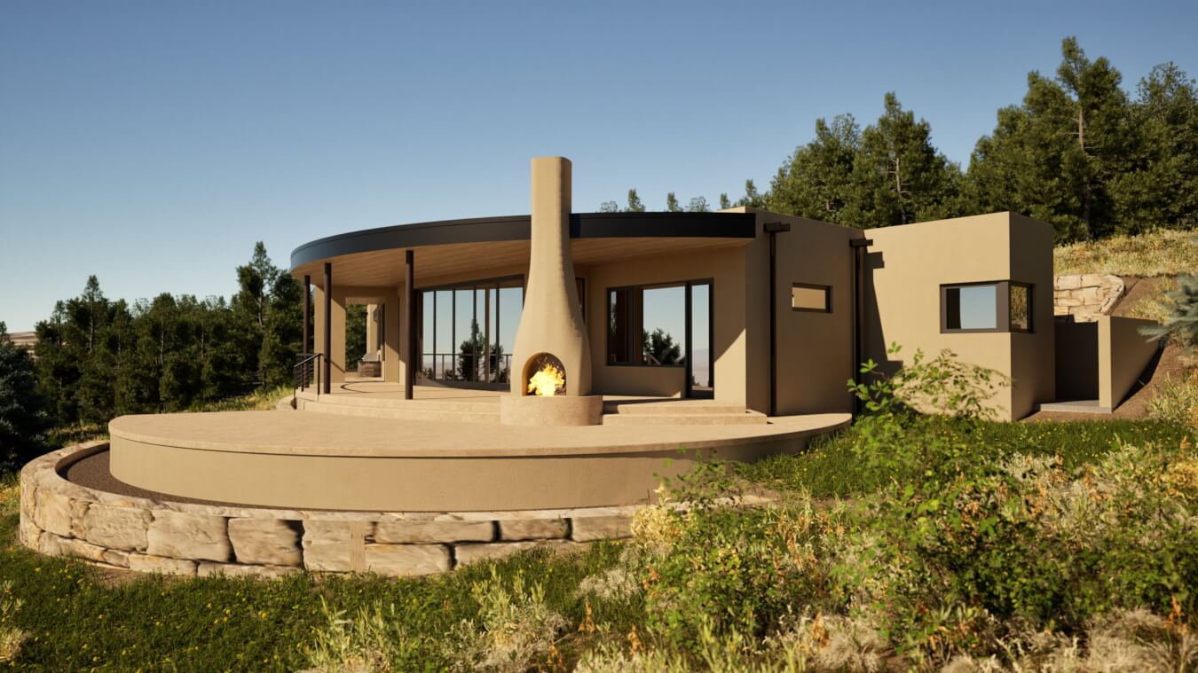 A modern, circular house with large windows and a central outdoor fireplace sits on a stone patio, surrounded by grass and trees under a clear sky.